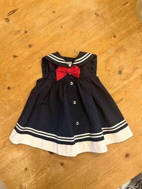 Good Lad Navy Dress with Red Bow Accent